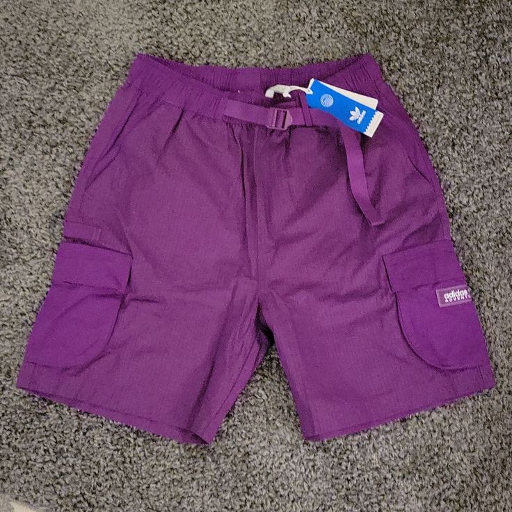 Adidas Purple Cargo Shorts Nwt Size Medium Great Royal Purple Color 9" Inseam 14.5" Waist (Elastic Sinch Cargo Belt Waist) Purple Nike Shorts Men, Adidas Cotton Bottoms With Built-in Shorts, Adidas Athletic Shorts For Streetwear, Adidas Shorts For Spring Streetwear, Adidas Spring Streetwear Shorts, Casual Adidas Shorts For Streetwear, Adidas Athletic Cotton Shorts With Built-in Shorts, Adidas Cotton Athletic Shorts For Spring, Adidas Bottoms With Side Pockets For Streetwear