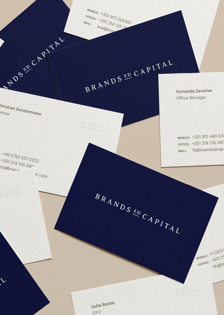 several business cards laying on top of each other with the words brands capital printed on them