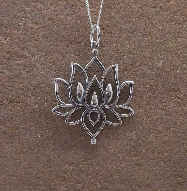 "Beautiful sterling silver lotus flower mandala pendant necklace.  The pendant measures 2.6cm in height (not including the bale) and 2.4cm in width.  Looks beautiful as a choker on the 16\" chain.  The necklace hangs from a sterling silver curb chain (please choose desired length from the drop-down menu. Lovely gift idea. Wrapped in tissue paper and presented in an organza pouch. Please note the bail may differ to the one pictured." Oxidized Pendant For Meditation, Oxidized Finish Pendant For Meditation, Spiritual Oxidized Flower Pendant Jewelry, Bohemian Sterling Silver Flower Necklace, Sterling Silver Spiritual Necklace With Flower Charm, Spiritual Sterling Silver Necklace With Flower Charm, Sterling Silver Pendant Necklace For Meditation, Delicate Silver Necklace For Meditation, Sterling Silver Pendant Charm Necklace For Meditation