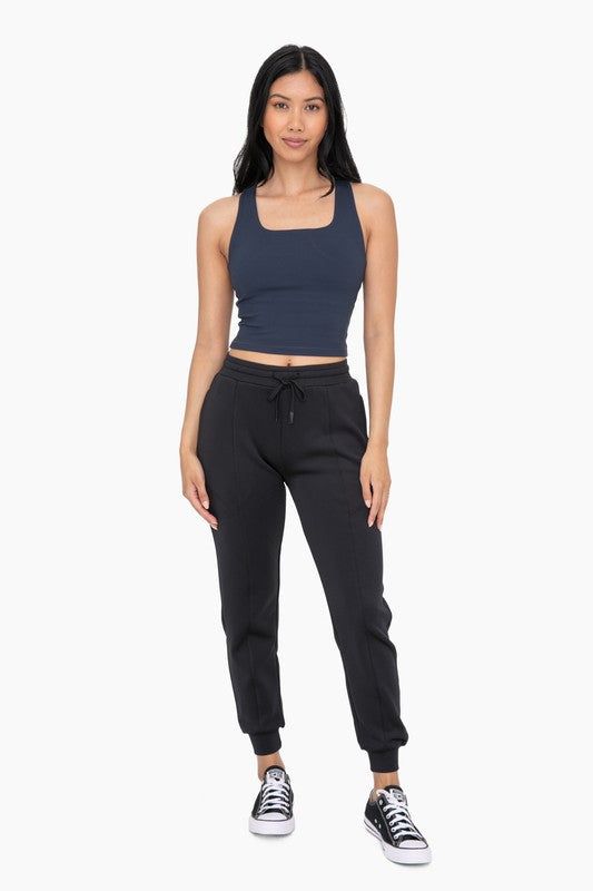 Unleash your inner athlete with our Everyday Comfort Jogger. Made from a soft and stretchy blend, these joggers feature an elastic waistband with a drawstring and convenient zippered pockets. Perfect for lounging or on-the-go, these cuffed joggers offer both comfort and style in one. Model is 5'8" Size 2 and wearing a Size Small. AP7013 Athleisure Joggers With Stretch And Functional Drawstring, Stretch Athleisure Joggers With Functional Drawstring, Sporty Joggers With Functional Drawstring, Athleisure Joggers With Functional Drawstring, Athleisure Sweatpants With Drawstring For Workout, Athleisure Sweatpants With Drawstring For Sports, Athleisure Jogging Pants With Drawstring, Stretch Sweatpants With Drawstring For Workout, Athleisure Drawstring Sweatpants For Workout