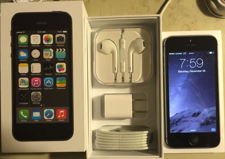 an iphone and ear buds in a box