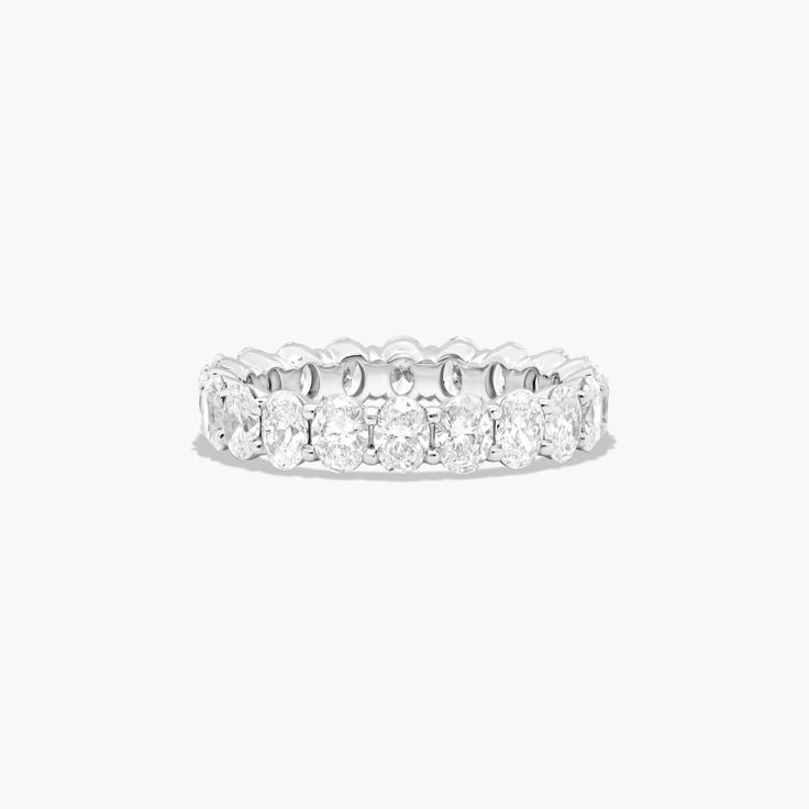 a white gold ring with five diamonds