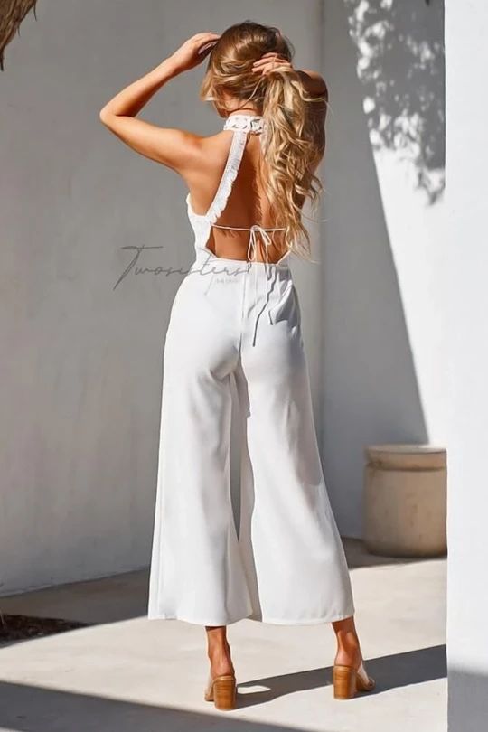 FREE 2-3 DAY SHIPPING USA WIDE. The Bree Jumpsuit in White is stunning. It has a high neckline with an open back and is fully lined to cover undergarment. Please note that the pants of the colored jumpsuits (Mauve & Steel Blue) do not have lining. It has a center back zipper. *Model is 5'7" and wears a size 4/SMALL *Model measurement - Bust: 84cm Elegant Spring Jumpsuits And Rompers With Back Opening, Elegant High Neck Stretch Jumpsuits And Rompers, Chic White Tie Back Jumpsuits And Rompers, Chic White Tie-back Jumpsuits And Rompers, Chic White Jumpsuits And Rompers With Tie Back, Chic White Tie-back Jumpsuit, Chic White Backless Jumpsuit, Sleeveless Spring Jumpsuits And Rompers With Back Zipper, Sleeveless Jumpsuit With Back Zipper For Spring