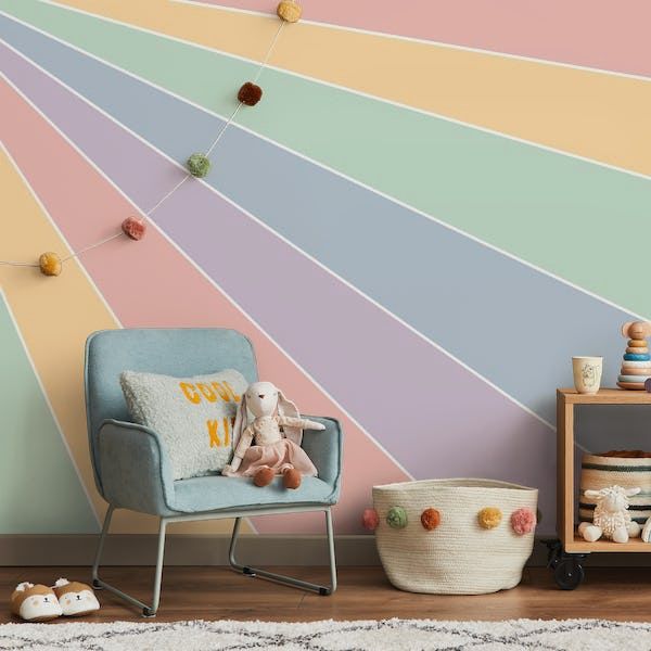 a child's room with pastel stripes on the wall