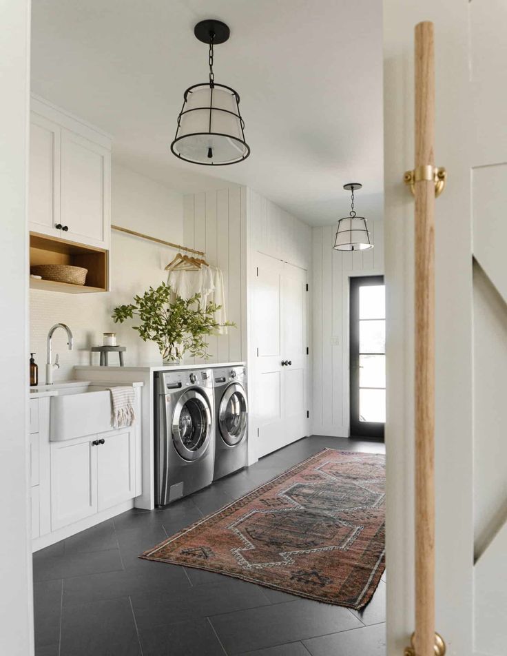 a washer and dryer in a white kitchen