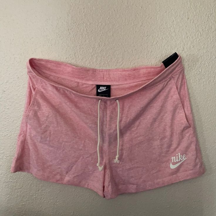 Pink Nike Shorts Perfect For Running Errands Lounging At Home Or The Beach Nike Bottoms With Elastic Waistband For Leisure, Nike Leisure Bottoms With Elastic Waistband, Nike Lounge Shorts With Pockets, Nike Loungewear Shorts With Pockets, Comfortable Nike Bottoms With Built-in Shorts, Nike Shorts With Pockets For Loungewear, Nike Casual Athletic Shorts For Summer, Casual Nike Athletic Shorts For Summer, Casual Nike Shorts For Summer