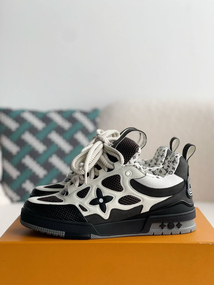 Embrace a bold and sophisticated aesthetic with these Louis Vuitton LV Skate-inspired sneakers in a timeless black and white colorway. Crafted with meticulous attention to detail, these shoes feature a unique blend of materials, including breathable mesh and luxurious leather, for a sporty and refined look. The signature Louis Vuitton monogram subtly adorns the design, adding a touch of understated luxury. Whether you're hitting the streets or the skate park, these sneakers will elevate your sty Fall Winter Jacket, Loafer Sneakers, Bottega Veneta Shoulder Bag, Skate Park, Shoe Box, The Streets, White Sneaker, Loafer Shoes, Louis Vuitton Monogram