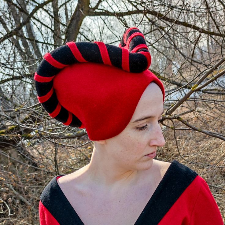 Material: WOOL. Handmade Size: provide us with your head girth during order placement. Step back in time to the late Middle Ages with our exquisite escoffion, a distinctive headwear cherished by women of that era. This enchanting headdress comprises two essential components: a bonnet and a contrasting roll. *Key Features* → Timeless Elegance: The escoffion boasts a captivating design with its bonnet and roll, expertly paired in contrasting colors for a striking visual effect. → Attention to Deta Fitted Fantasy Costume Accessories For Winter, Fitted Hat For Cosplay, Fitted Fantasy Hat For Costume Party, Fitted Costume Hats And Headpieces For Cosplay, Fitted Red Halloween Hat, Gothic Fitted Costume Hats And Headpieces, Traditional Fitted Costume Hats And Headpieces, Red Fitted Hat For Costume, Fitted Fantasy Costume Hats And Headpieces For Cosplay