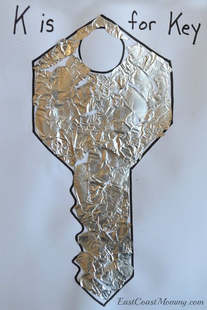 a piece of tin foil that has been cut into the shape of a key on it