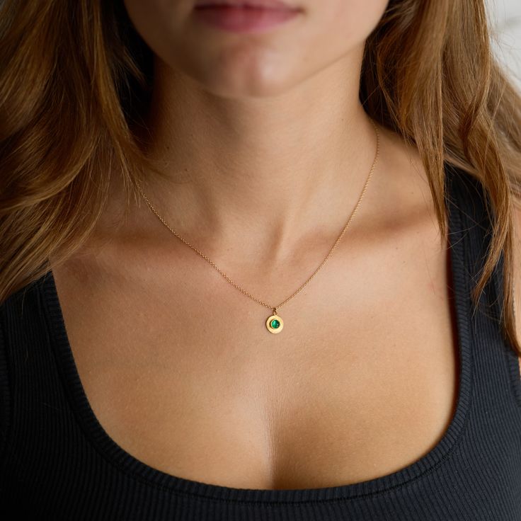 Evoking both modern and ancient energies, a luscious rose cut emerald is wrapped in warm 22k gold, set on a hammered 22k gold disk, and suspended from a delicate 14k gold chain. Simple and so elegant. Pendant measures approximately 3/8 inch in diameter. Matte finish. Gold Dainty Emerald Necklace, Gold Emerald Birthstone Necklace In Minimalist Style, Dainty Gold Emerald Round Necklace, Gold Emerald Necklace With Round Birthstone, Gold Minimalist Emerald Birthstone Necklace, Minimalist Gold Emerald Birthstone Necklace, Gold Emerald Round Pendant Necklace With Birthstone, Gold Emerald Necklace With Round Pendant Birthstone, Dainty Gold Emerald Necklace