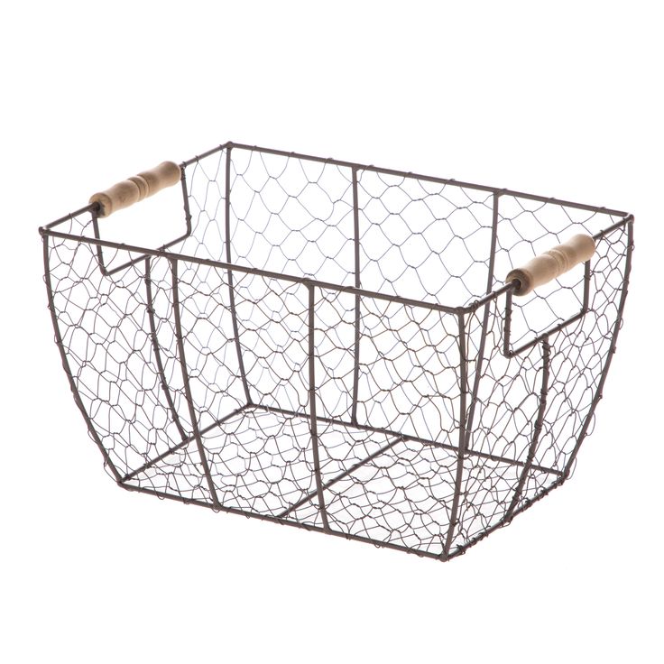 a metal wire basket with two rolls of toilet paper in the bottom and one roll on top