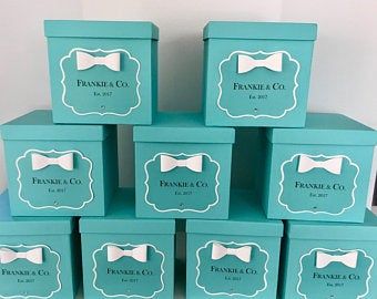 six blue boxes with white bow ties on them