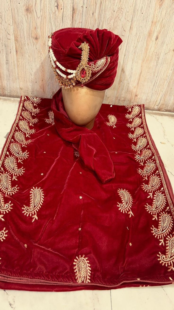 These Indian-style accessories enhance your overall appearance. The Indian-style Safa (turban) and dupatta are crafted to perfectly complement your outfit. Stole/ Dupatta * Colour - Radish Maroon /Maroon / Durk maroon / red / Coffee * Fabric - Velvet * Work - Golden Zari Border * Length - 2.5 mtrs Saffa/ Hat * Rajwadi Style Safa * Colour - Radish Maroon /Maroon / Durk maroon / red / Coffee * Fabric - Velvet * Work - Golden Zari Work We Can Also Customised Any Dupatta Or Pagdi As Per Your Requirement. Kindly Get In touch for Any Colour And Customization Navratri Traditional Drape Dola Silk Sherwani, Sherwani With Dori Work For Navratri Puja, Navratri Sherwani With Dori Work For Puja, Navratri Dola Silk Sherwani With Traditional Drape, Red Dori Work Sherwani For Festivals, Red Sherwani With Dori Work For Festivals, Semi-stitched Tilla Dupatta In Dola Silk, Traditional Nida Sharara For Ceremonies, Traditional Drape Sherwani With Dori Work For Navratri