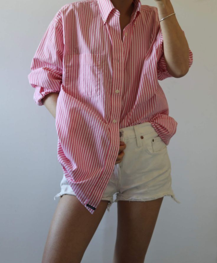 Great button down in overall good condition with a couple of tiny sports (please look at all photos)  Perfect for beach, city strolls, or just to throw on and wear in the house lounging around. Boyfriend shirt listed as size XL but can fit various sizes, please check with the measurements below. Pictured on 5.7 117 lb size 2 body. Pit to pit - 24 Shoulders - 20 Total length- 32 Please message me with any additional questions. Thank you all sales are final Pink Relaxed Fit Summer Shirt, Oversized Pink Shirt For Day Out, Pink Shirt For Everyday Summer Wear, Pink Summer Shirt For Everyday Wear, Pink Everyday Shirt For Summer, Pink Summer Shirt For Everyday, Casual Pink Shirt With Vertical Stripes, Pink Casual Shirt With Vertical Stripes, Pinstripe Button-up Shirt For Summer