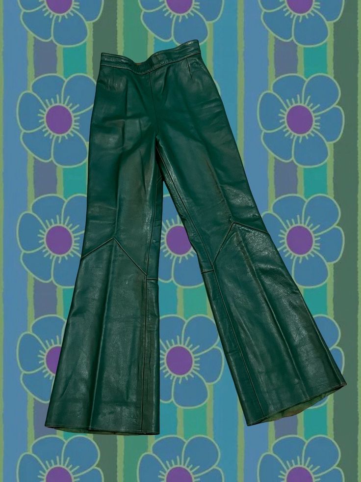 RARE 60s/70s Hunter green full leather pants with cognac brown leather lacing + painted details. Pants have no brand tag, but appear professionally made. Zipper and button closure at waist - interior lined with acetate. High waisted fit, and longer inseam - looks best with heeled shoes unless you are on the taller side!  PLEASE SEE NOTICE AT BOTTOM OF AD RE: RETURNS/REFUNDS FOR THIS ITEM Pants have a few flaws: some loose threads at back waistline, lining near zipper appears to have been glued d Vintage Leather Bottoms With Belt Loops, Vintage Leather Pants For Fall, Vintage Fitted Leather Pants For Fall, Green Fitted Leather Bottoms, Fitted Green Leather Bottoms, Green Leather Bottoms For Fall, Green Leather Pants For Fall, High-waist Green Leather Pants For Fall, High Waist Green Leather Pants For Fall