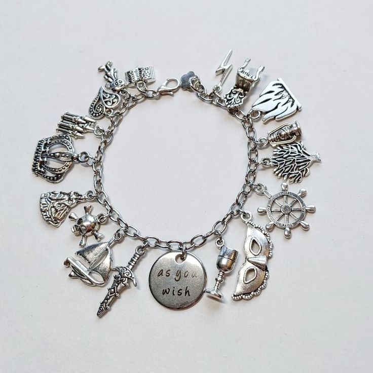 "\"As you wish\".... INCLUDES: -Charm Bracelet: chain, silver-plated alloy (zinc) charms with lobster clasp. Length is determined from clasp to last link, multiple options available, and bracelet is adjustable due to the larger chain links. -Packaged in a cotton-filled jewelry box. -All materials are hypoallergenic and nickel-free for sensitive skin." Personalized Silver Alloy Jewelry, Customized Silver Metal Bracelets, Customized Silver Metal Jewelry, Silver Bracelets With Lobster Clasp For Friendship, Personalized Silver Metal Charms, Personalized Themed Charm Bracelet For Friendship, Silver Themed Bracelets For Friendship, Nickel Free Silver Themed Charms, Personalized Silver Metal Bracelets