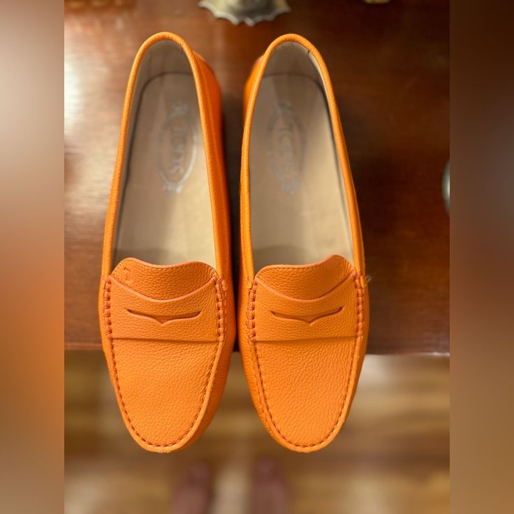 Tod’s Loafers, Orange Leather, Size 41, In Box With Duster Bag. Never Worn Orange Loafers With Round Toe For Spring, Orange Round Toe Loafers For Spring, Spring Orange Loafers With Round Toe, Spring Orange Round Toe Loafers, Elegant Orange Loafers With Leather Sole, Classic Orange Loafers With Leather Sole, Orange Slip-on Loafers For Formal Occasions, Orange Loafers With Leather Sole For Formal Wear, Classic Orange Leather Loafers