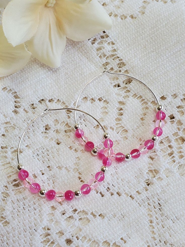 These lovely hoop earrings are the perfect touch to any outfit, as well  as super lightweight and so much fun to wear! Made with silver, bright pink and pink. Hoop measures 1.5 inches. Pink Small Hoop Earrings For Party, Pink Beaded Hoop Earrings For Party, Trendy Pink Hoop Earrings As Gift, Trendy Pink Hoop Earrings For Summer, Pink Hoop Jewelry For Summer, Summer Hypoallergenic Pink Jewelry, Pink Small Hoop Earrings For Gift, Small Pink Hoop Earrings Nickel Free, Pink Hoop Earrings As A Gift