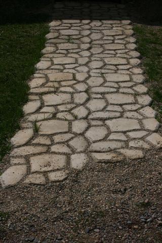 an image of a stone path in the grass