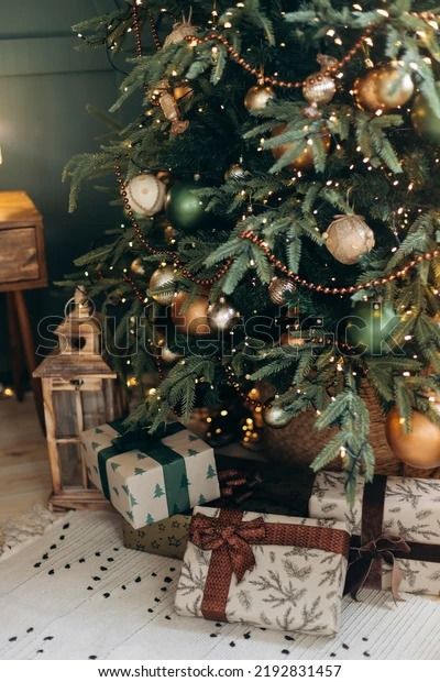 a christmas tree with presents under it