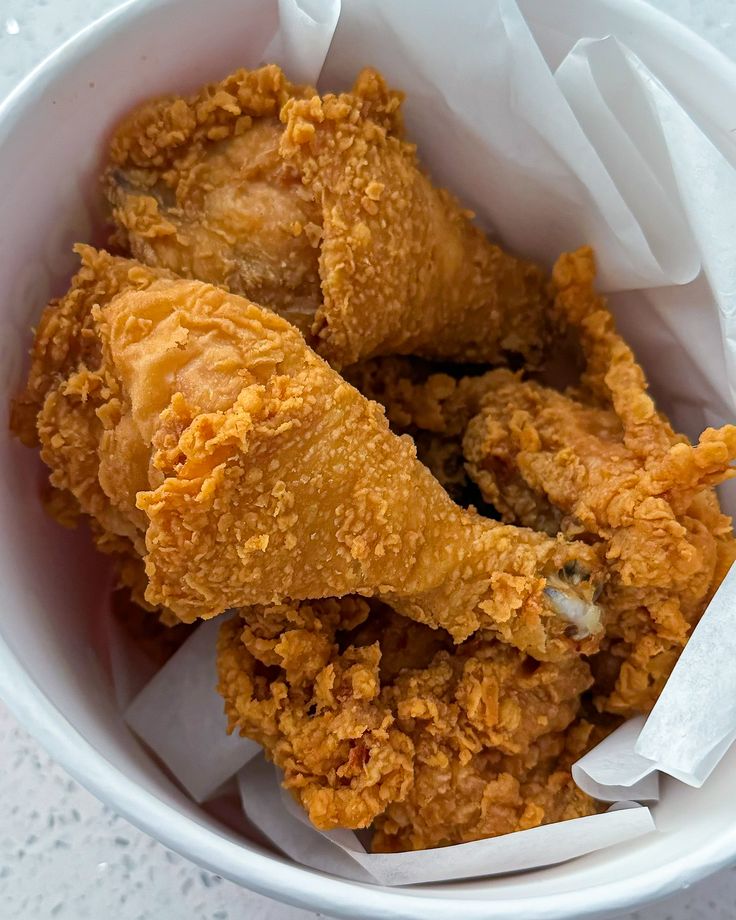 fried food in a white bowl on a table