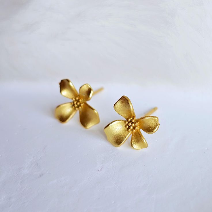 Beautiful, delicate pair of dainty gold floral studs in a lovely texture. This gorgeous piece is made with love and is going to add that extra sparkle to your outfit; just thread the smooth end through your ear and get loaded with compliments.  Matching dainty two toned floral bracelet available now!  Material: Matt 18k Gold plated on stainless steel.  ✨️ Packaging: Your item will arrive carefully, lovingly wrapped in a gift box, adorned with ribbons laces, and tissues. Perfect for giving or kee Tiny Delicate Gold-plated Earrings, Tiny Delicate Gold Plated Earrings, Gift Gold Flower Earrings Tarnish Resistant, Dainty Rose Gold Flower Earrings Gold Plated, Gold Earrings With Flower Charm For Her, Gold Tarnish-resistant Flower Earrings For Gift, Gold Tarnish-resistant Flower Earrings Perfect For Gifts, Gold Earrings With Flower Charm As Gift For Her, Dainty Rose Gold Plated Flower Earrings