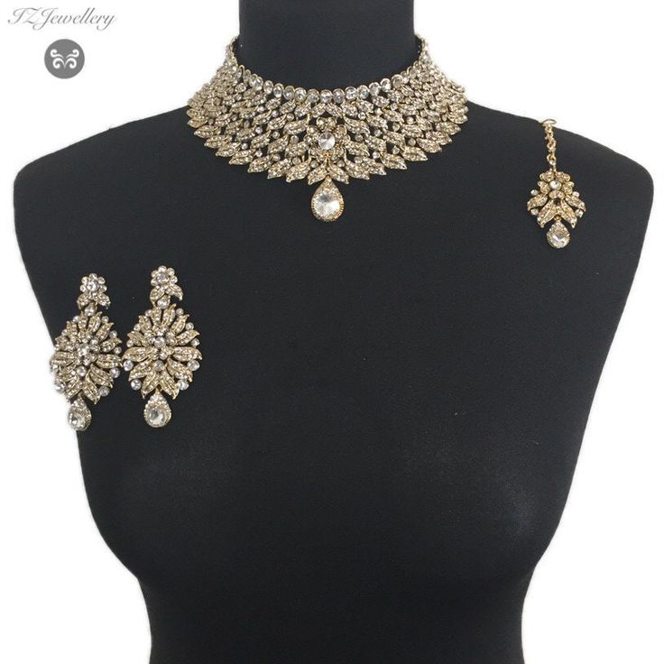 Golden jewellery set. Set includes- Necklace  Earrings  Tikka Silver Gold-plated Bridal Sets For Party, Elegant Gold Plated Bridal Sets For Wedding, Glamorous Gold Sets For Diwali, Elegant Gold-plated Bridal Sets For Wedding, Bollywood Bridal Earrings Hand Set For Wedding, Elegant Hand Set Lehenga For Wedding, Diamond Bridal Earrings For Wedding, Festive Diamond Bridal Earrings For Wedding, Glamorous Gold Sets For Festivals