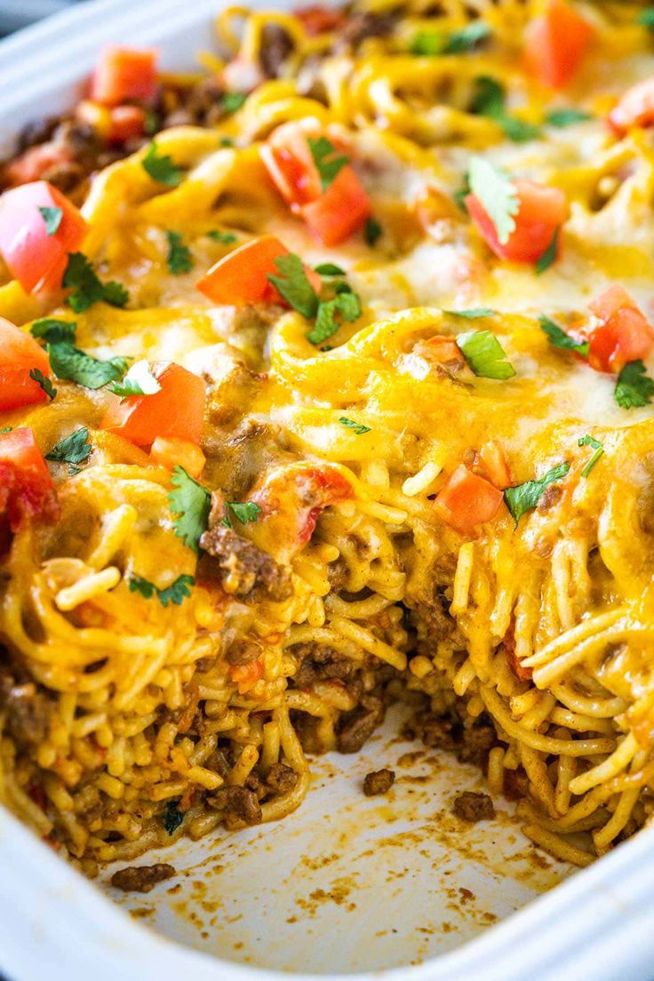 a casserole dish with meat, cheese and vegetables