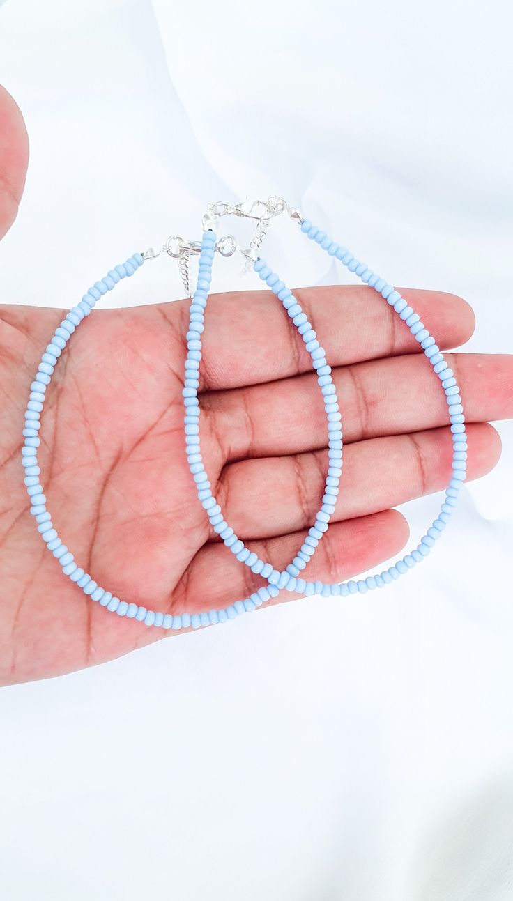 Smart Buys! BLUE Pastel Seed Bead ANKLET • Blue Kawaii Pastel anklet • Pastel Beaded Blue anklet • Simple Everyday anklet • Pastel Aesthetic blue anklet starting from £7.50 See more. 🤓 #PastelBeadAnklet #SummerBeadAnklet #TeenGirlAnklet #PastelAesthetic #PastelJewellery #PastelRainbow #VscoBracelet #CiteGirlAnlet #MinimalPastel #PastelGothBracelet Blue Beaded Chain Bracelets For Beach, Blue Beaded Chain Anklets As Gift, Blue Beaded Chain Anklets For Gift, Blue Tiny Beads Anklet For Gift, Blue Anklet With Tiny Beads For Gift, Blue Bracelet Anklets For Beach, Light Blue Beaded Bracelets As Summer Gift, Light Blue Beaded Bracelets For Summer Gift, Summer Light Blue Beaded Bracelets As Gift