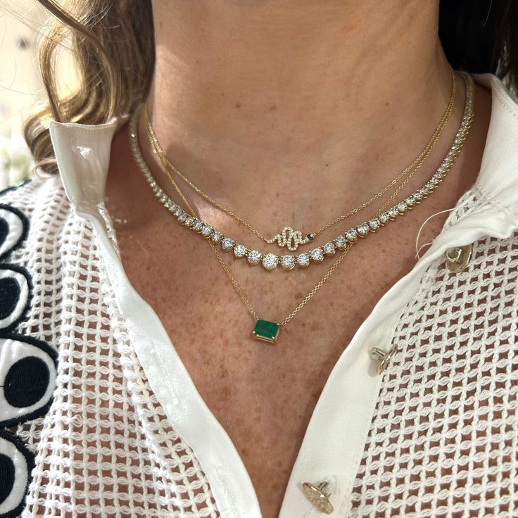 An eye-catching piece, perfect for layering or wearing solo! This item not eligible for promotions or discounts. Elegant Yellow Gold Emerald Necklace With Adjustable Chain, Elegant Gemstone Tennis Necklace, Elegant Round Gemstone Tennis Necklace, Dazzling Single Strand Necklace For Gift, Elegant Double Strand Diamond Necklaces, Luxury Oval Jeweled Necklaces, Elegant Double Strand Diamond Necklace, Luxury Jeweled Oval Necklaces, Luxury Long Necklace With Jewels