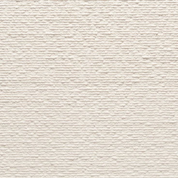 a white textured paper background that is very similar to the wallpaper in this house