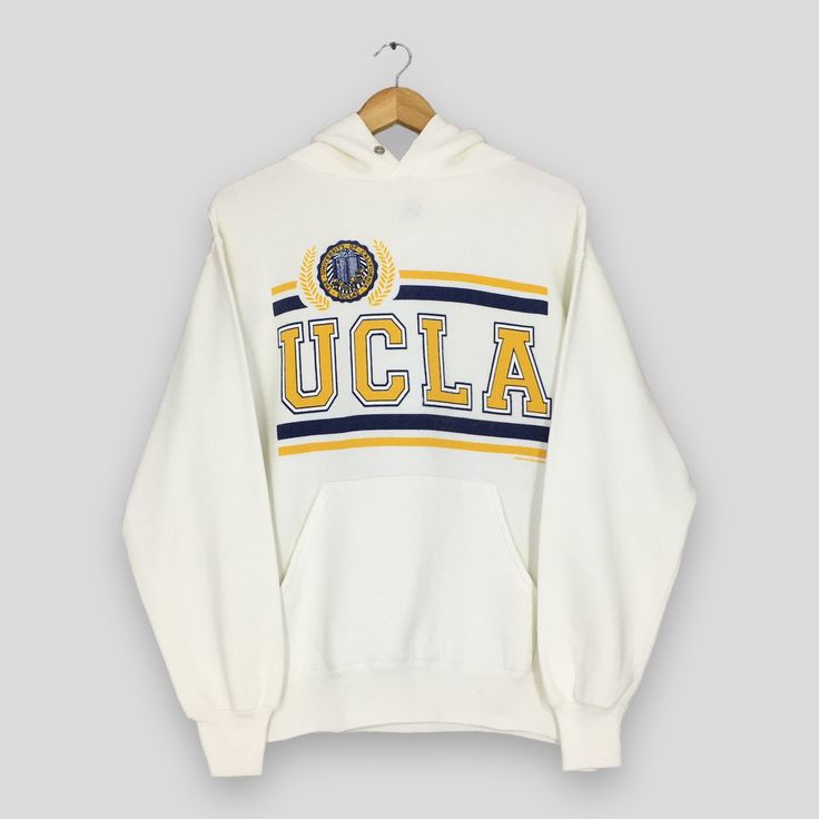 Vintage 90s University Of California Los Angeles Hoodie Sweater Medium UCLA Spell Out Pullover Jumper Ucla Bruins NCAA White Hoodies Size M Good Used Condition. No holes and stains. Size (On Tag) : Size M **To make sure if it FITS YOU, refer at the exact measurements. Size Measurement (All measurements were taken lying flat) : Width [armpit to armpit] : 19 inches / 48 cm Length [shoulder to end of garment] : 26 inches / 66 cm THIS IS USED CLOTHING! PLEASE DON`T EXPECTED IT TO BE LIKE NEW OR DON` Oversized Vintage Hoodie For College, Retro Sweatshirt For Game Day In Winter, Retro Game Day Sweatshirt For Winter, Retro Winter Game Day Sweatshirt, Retro College Hoodie With Drawstring Hood, Oversized Collegiate Hoodie For College, Retro Winter Hoodie With Ribbed Cuffs, Oversized Collegiate Hoodie For Winter, Winter Retro Hoodie With Ribbed Cuffs