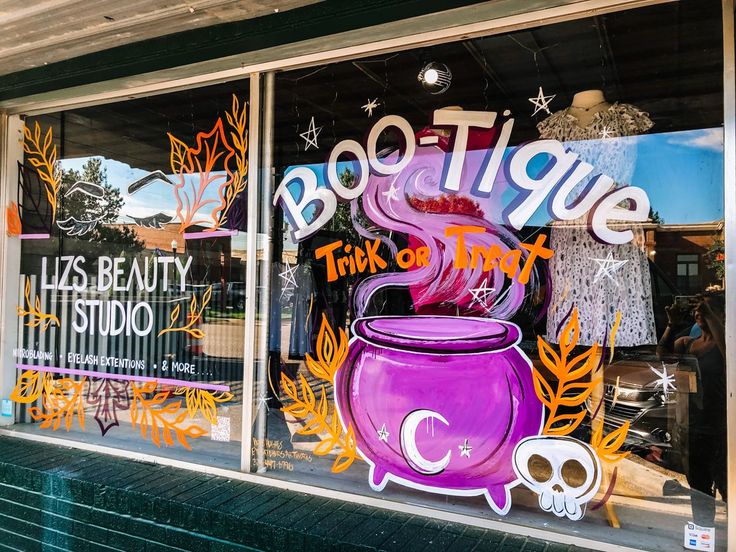 there is a purple pot on display in the window