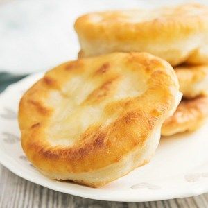 two pieces of bread sitting on top of a white plate