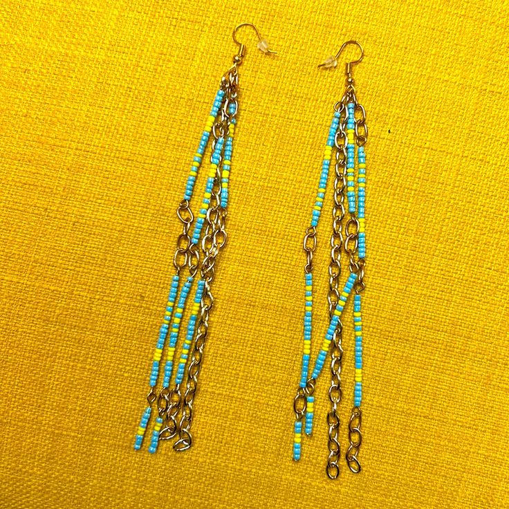 Handcrafted Beaded Gold Tone Blue Yellow Long Earrings 5.5” Long Super Fun Dangly One Of A Kind Perfect For Any Get Away Vacation Summer Festival. Can Be Customized And Made In Any Color Or Length For You Models Are Similar Earrings, Not The Same. Turquoise Beaded Earrings With Beaded Chain, Blue Round Beaded Earrings For Beach, Yellow Beaded Drop Earrings For Beach, Blue Beaded Earrings With Dangling Round Beads, Blue Earrings With Gold Beads, Blue Large Beaded Earrings For Beach, Blue Beaded Earrings For Beach, Blue Large Beads Earrings For Beach, Turquoise Beaded Chain Earrings