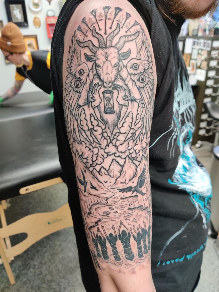 a man with a bear tattoo on his arm