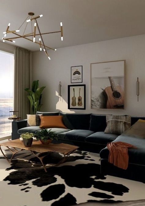 a living room filled with furniture and a large window overlooking the ocean in front of it