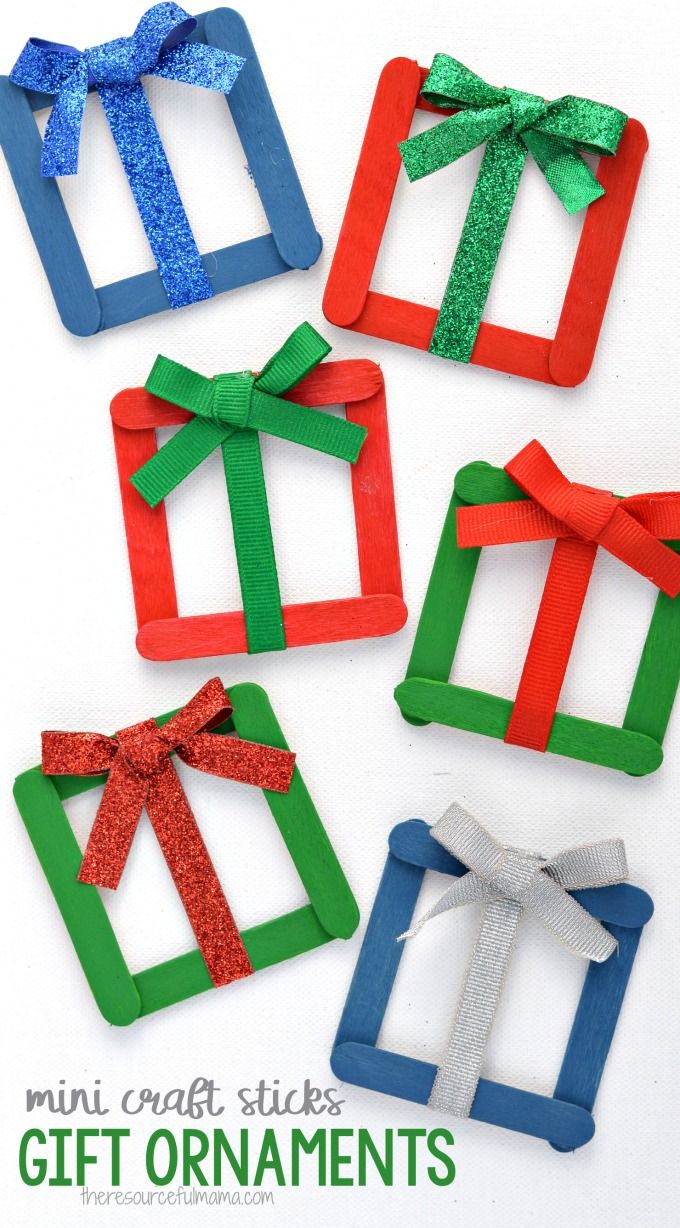 mini craft sticks decorated with bows and glitters for christmas ornament crafts that are easy to make