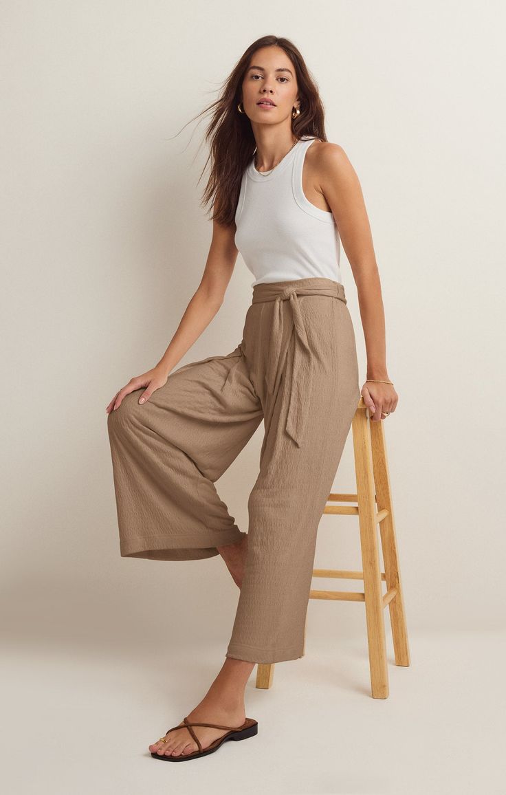 Take your casual look to the next level with the elevated, wide leg Isla Pucker Knit Pant. This pull on style features flattering details that will make this a pant you reach for on repeat. Wide-leg Solid Color Bottoms For Elevated Casual, Solid Wide-leg Bottoms For Elevated Casual Wear, Solid Color Wide-leg Bottoms For Elevated Casual, Wide-leg Bottoms For Casual Wear, Relaxed Spring Wide Leg Pants, Relaxed Wide Leg Pants For Spring, Versatile Wide Leg Pants, Trendy Wide Leg Pants For Elevated Casual Spring Occasions, Relaxed High-waisted Wide Leg Pants For Spring