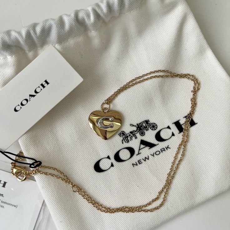 Coach Signature Necklace In Gold-Colored Brass. Number 7 Necklace, Coach Jewelry Necklace, Formula 1 Gifts, Coach Necklace, Birth Year Necklace, Vintage Chanel Jewelry, Dope Jewelry Accessories, Medical Jewelry, Signature Necklace