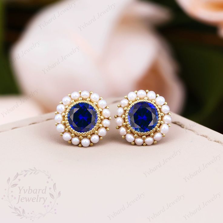 "❤Jewelry Details -Gold Type : Solid 10K Gold / Solid 14K Gold / Solid 18K Gold / Platinum (Choose One in Material Option) -Center Stone: Lab Created Sapphire 5.0mm, Approximately 0.5ct*2pcs Cut: Round Cut / 3EX -Side Stone: Natural Pearl Earring outer diameter: 9.0mm SKU: YE0061 ~*-*~Purchase Guarantee: - All our jewelry is handmade, and each process is refined. - 14 Day Refund Guarantee. - All our products are Free Shipping. - Free Gift Box&Packing. ~*-*~Please contact us if you need service: 1. Ring Resizing. 2. Metal Change(PT950/10k/14k/18k White/Yellow/Rose Gold). 3. Engraving ring (less than 10 letter). 4. Accept customization. We believe that our quality, attention to detail, design and customer service make us stand out from the competition. If you have any questions, please let m Wedding Pearl Earrings With 17 Jewels, Blue Pearl Earrings For Anniversary Fine Jewelry, Wedding Pearl Earrings Round Shape, Wedding Round Pearl Earrings, Blue Pearl Earrings For Anniversary, Blue Round Pearl Earrings For Anniversary, Blue Pearl Wedding Earrings, Fine Jewelry, Blue Pearl Earrings For Wedding, Fine Jewelry, Blue Pearl Earrings For Wedding