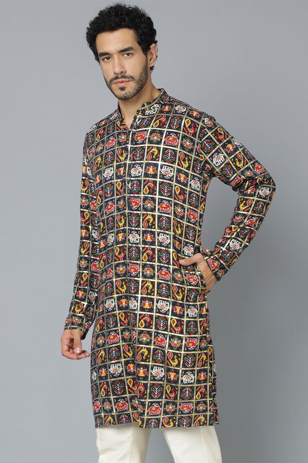 VASTRAMAY Men's Navy Blue Patola Print Ethnic kurta Add a touch of ethnic elegance to your wardrobe with this VASTRAMAY kurta. It features a beautiful navy blue base with a traditional patola print, making it perfect for any special occasion. Features Navy blue color with patola print Mandarin collar Full sleeves Knee length Pockets Specifications Material: Cotton Blend Top Length: Knee Length Sleeve Length: Full Sleeves Material & Care Top Fabric: Cotton Blend Care: Dry Clean Only Legal Disclai Traditional Bandhgala With Long Sleeves And Printed Motifs, Traditional Long Sleeve Bandhgala With Printed Motifs, Bollywood Style Sherwani With Printed Motifs, Bollywood Nehru Jacket With Printed Motifs For Festivals, Festive Nehru Jacket With Printed Motifs, Long Sleeve Bandhgala With Printed Motifs For Eid, Navratri Sherwani With Printed Motifs, Diwali Bandhgala With Printed Motifs, Traditional Multicolor Nehru Jacket With Printed Motifs