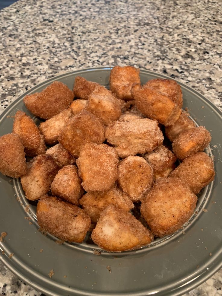 a plate filled with fried food on top of a counter