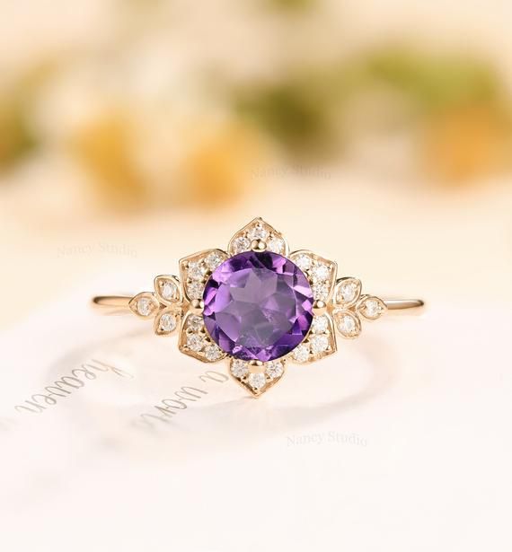 an oval shaped amethorate ring with diamond accents