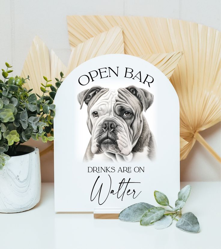 an open bar sign with a dog's face on it next to a potted plant