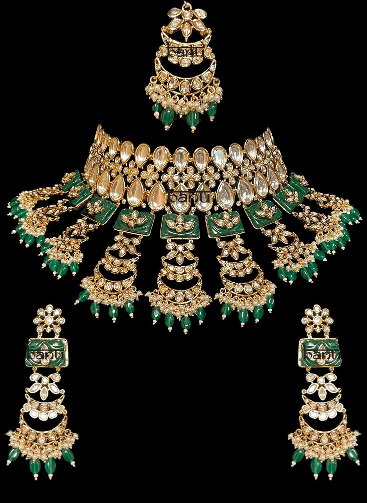 Tiana I - Indian Bridal Set w/ Emerald Drops, Kundan & Green Meenakari work Stunning modern choker necklace for Indian brides with Kundan stone setting. Fit for any fashionista who appreciates the beauty of fine craftsmanship and design all in one stunning set! Stunning green Meenakari work adorns this bridal set in square-shaped metal detail. This set is elaborated with moon design detailing of Kundan gems. This classic bridal jewelry is accented with mini green emerald stone drops at the ends. Green Kundan Chandbali Jewelry, Ceremonial Kundan Jewelry Set With Meenakari, Ceremonial Green Kundan Necklace, Green Intricate Design Sets For Festivals, Festive Green Sets With Intricate Design, Ceremonial Kundan Bridal Sets With Meenakari, Green Kundan Bollywood Jewelry, Heavy Green Kundan Jewelry, Ceremonial Meenakari Kundan Bridal Sets