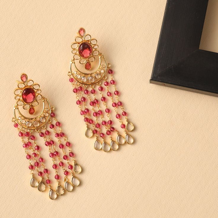 Classic Beads Chandbali Earrings Affordable Elegant Chandbalis For Diwali, Luxury Gold Chandbali Gown, Luxury Green Chandbalis With Tilla Detail, Luxury Chandbali Earrings With Elegant Design, Luxury Gold Chandbali Chandelier Earrings, Red Chandbali Jewelry With Dangling Beads, Fusion Chandbali Kundan Bridal Earrings, Festive Fusion Chandelier Earrings With Stone Work, Festive Fusion Chandelier Earrings With Latkans