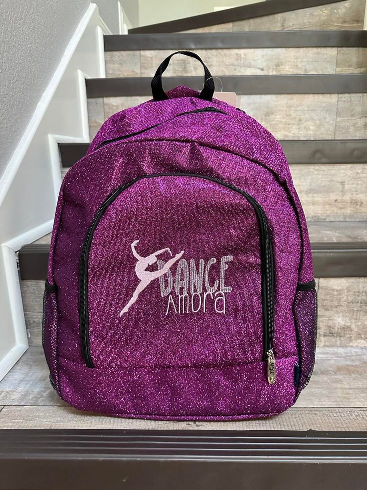 "Large Purple Glitter Backpack A cute and trendy backpack, perfect for back to school! Material:Canvas NGIL Brand. Outside: Zipper Closures, Two Side Net Open Pockets, and one Front Zipper Pocket 15\" Adjustable straps  Material: Nylon / Polyester        Dimensions Approx.: 13 ¼\"(L) X 5\"(W) X 15\"(H)     ORDERING INFORMATION Please put the following information in the \"Notes to Seller\" at checkout: 1. Name for Personalization  2. Please let me know what color of thread you would like. 3. Ple Trendy Purple Backpack For End Of School Year, School Backpack With Glitter Details, School Glitter Backpack, Purple Backpack For School Events, School Backpack With Glitter, Purple Backpack For End Of School Year, Purple Standard Backpack For End Of School Year, Preschool Lunch Box, Glitter Backpack