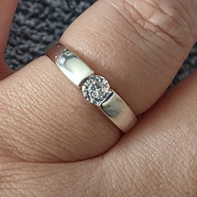 "Solid 925 Sterling silver rings  Cubic Zirconia  Band Width 4mm In ring sizes G-Z The rings are made of solid 925 Sterling Silver  ( not plated) Average weight 3grams depending on size \"\"\"Guaranteed Genuine .925 Sterling Silver, Not Plated, Not Filled, Not Bonded.\"\"\" Comes Gift Boxed" Classic Silver Ring With Single Diamond, Classic Silver Birthstone Ring With Single Diamond, Silver Classic Birthstone Ring With Single Diamond, Classic Silver Stackable Rings With Vvs Clarity, Silver Diamond Ring With Round Band, Classic Sterling Silver Couple Rings, Classic Silver Birthstone Ring With Tension Setting, Classic Sterling Silver Birthstone Ring With Tension Setting, Sterling Silver Diamond Ring With Tension Setting For Anniversary