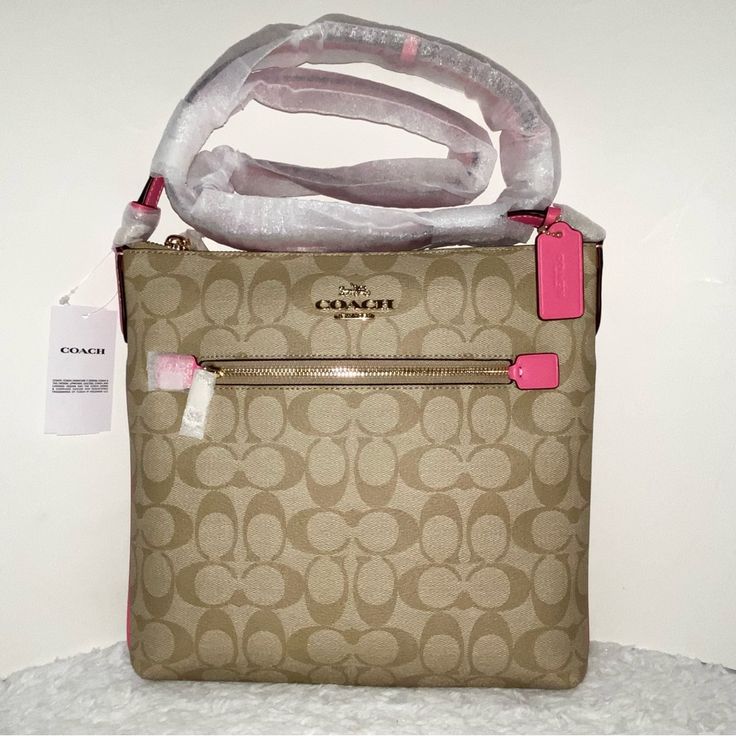 Coach Rowan File Bag In Signature Canvas New 100 % Authentic Khaki And Petunia Colors With Gold Hardware Bag Details Signature Coated Canvas Smooth Leather Inside Multifunction Pocket Zip-Top Closure Outside Zip Pocket Adjustable Strap With 21 3/4" Drop Approximate Measurements 10 1/4" L X 9 3/4" H X 1 1/2" W Smoke And Pets Free Pink Coach Bag With Zipper Closure, Pink Coach Crossbody Shoulder Bag, Designer Pink Bag With Zipper Closure, Designer Pink Shoulder Bag With Zipper Closure, Coach Pink Crossbody Bag, Pink Coach Crossbody Bag, Pink Convertible, Blue Coach, Coach Crossbody Purse